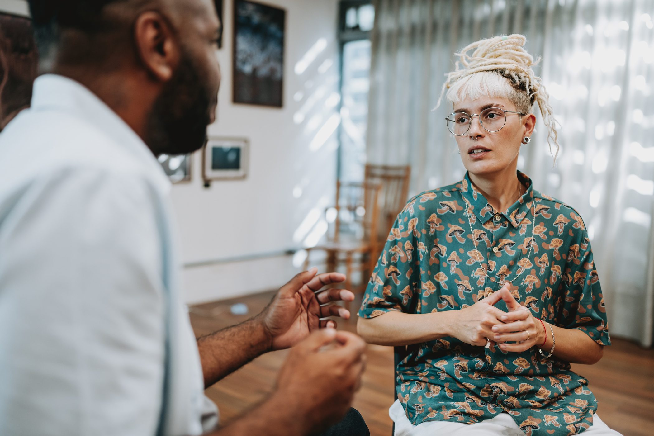 Two adults in a therapy session.
